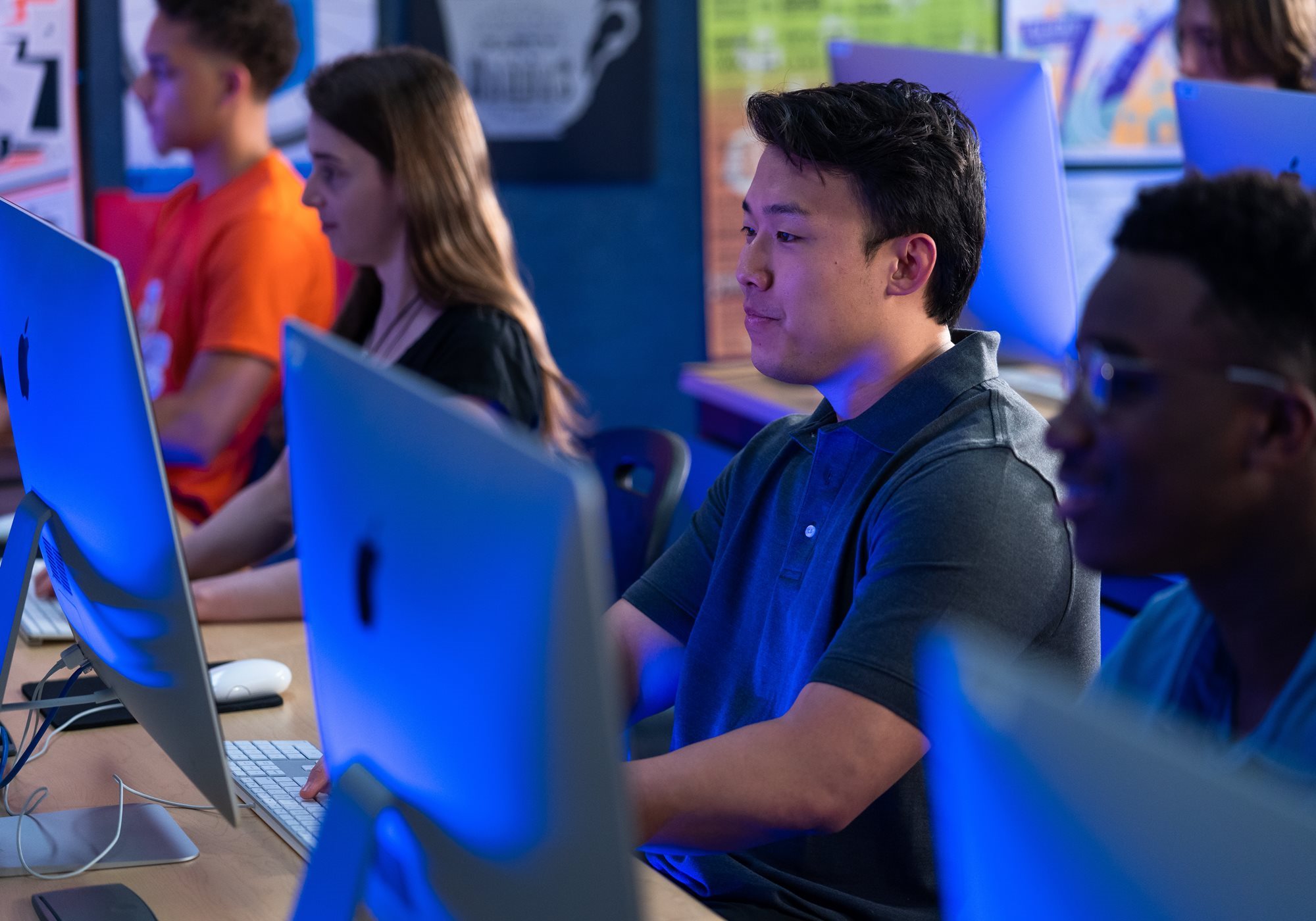 Male student looking at monitor