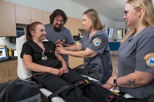 Health students helping female