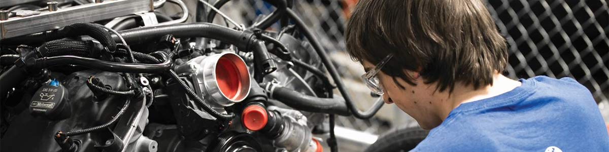 A student working on an engine