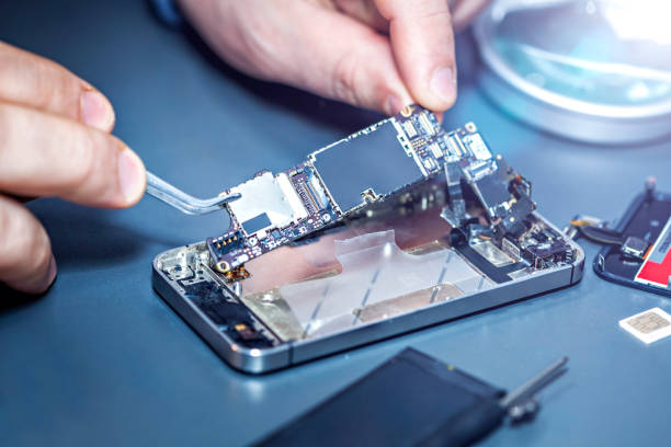 Student installing motherboard into iPhone