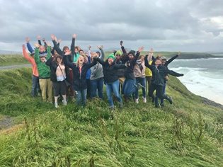 A group of students in Ireland on the coast
