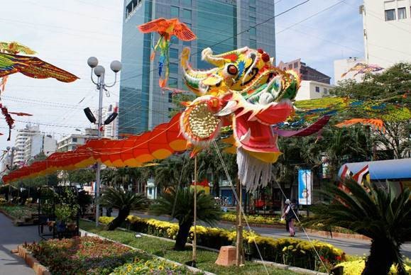 Vietnamese multicolored dragon suspended over garden and walkway
