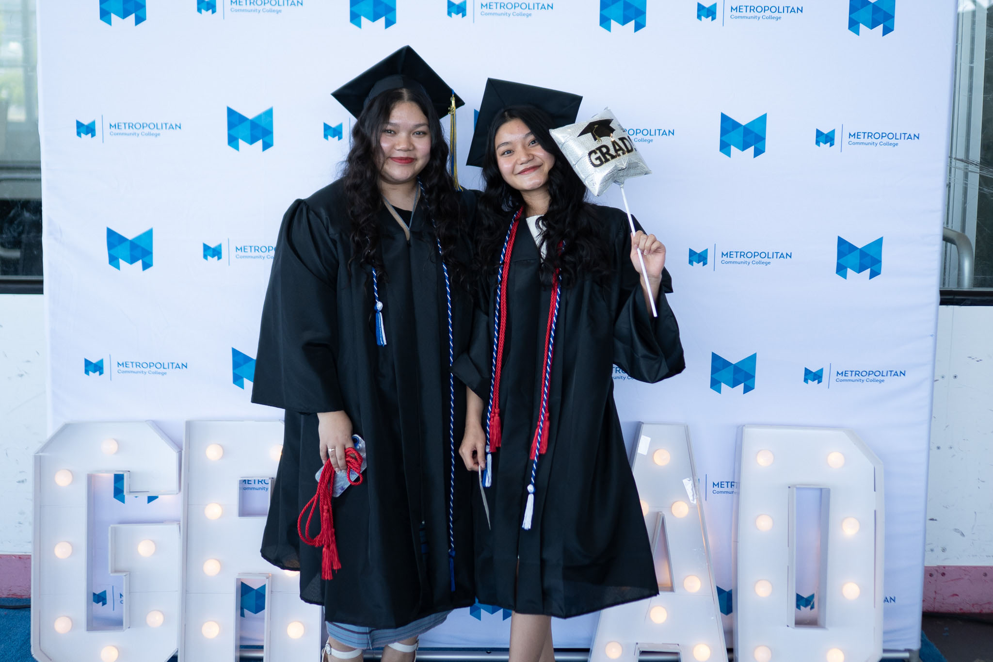 Two female graduates posing for photo