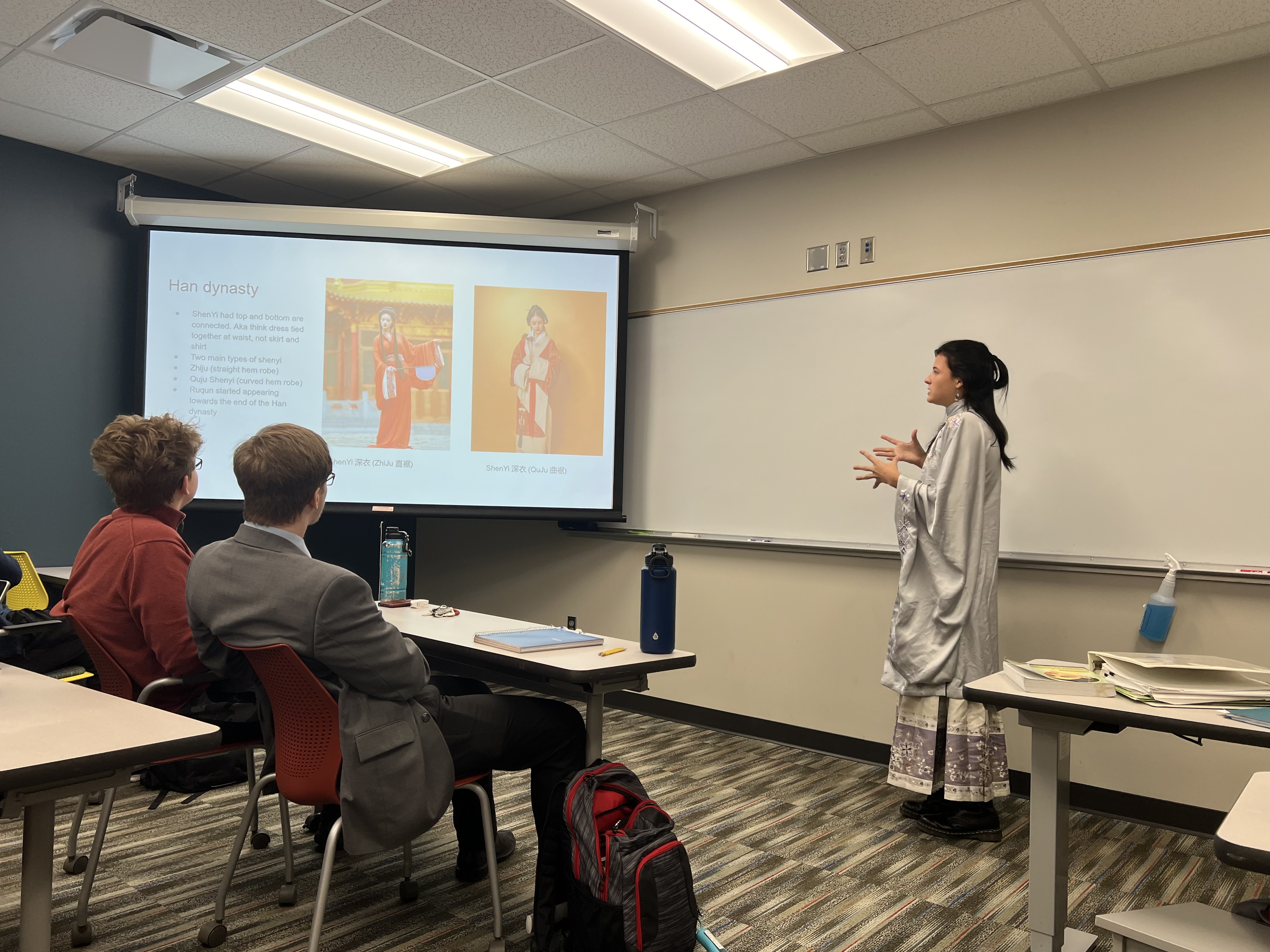 Person giving presentation on Han Dynasty robe in front of class