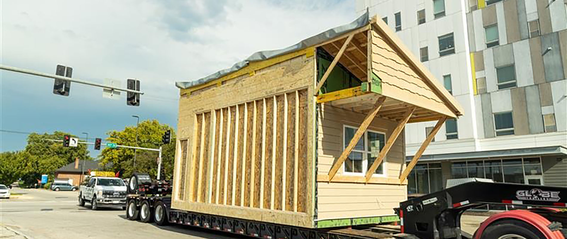 Structure of a house made of wood being transported