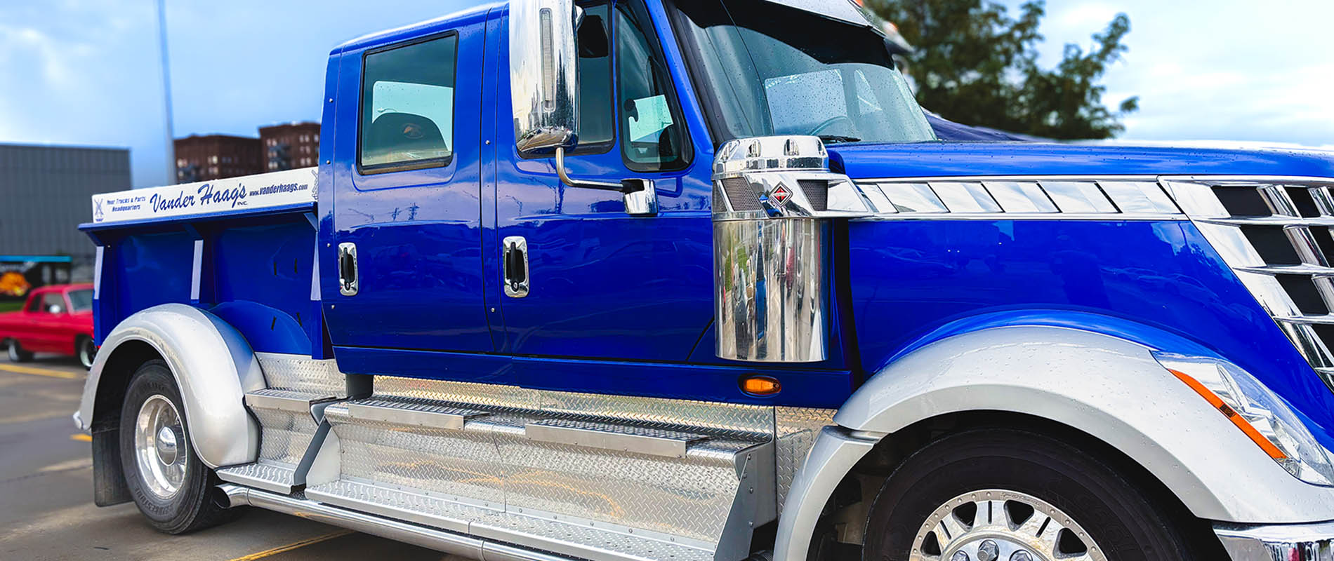 Photo of a blue semi trucked parked